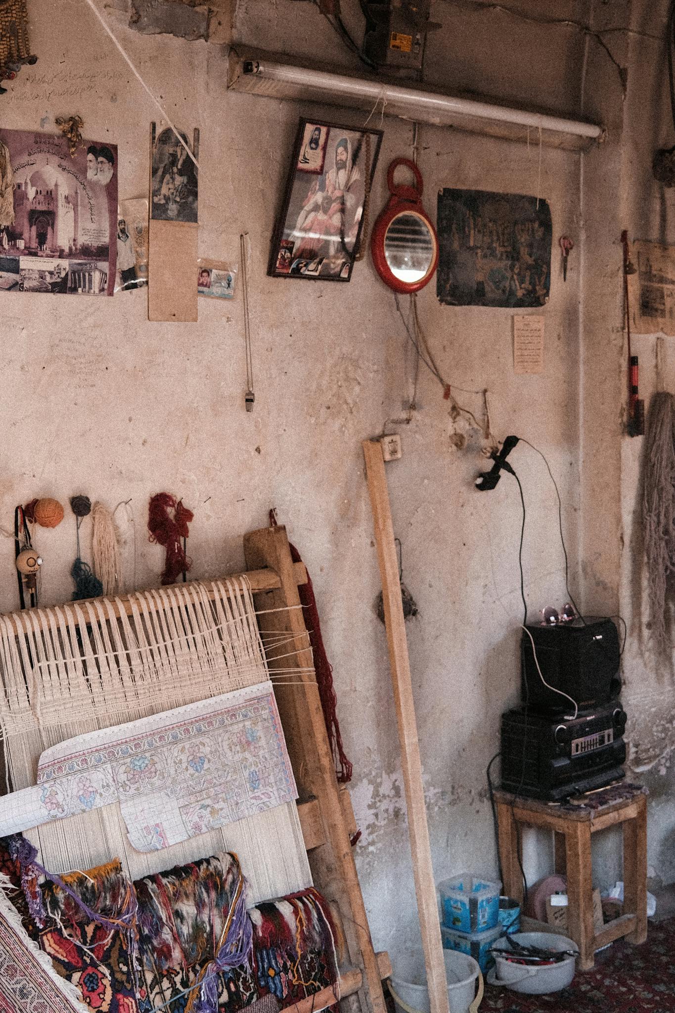 A cozy indoor setting showcasing traditional wall decorations and a handcrafted tapestry.